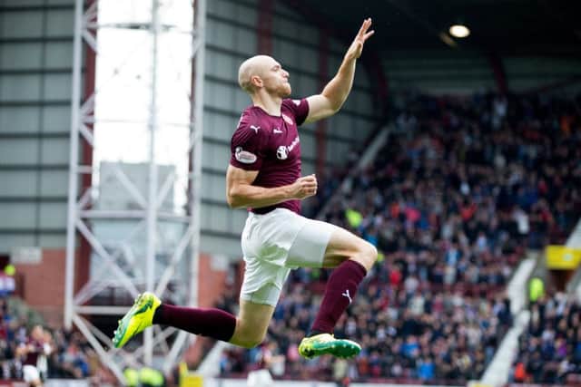 Conor Sammon, who had been judged harshly by some sections of the Hearts support, celebrates scoring his sides second goal against Inverness on Saturday. Picture: SNS