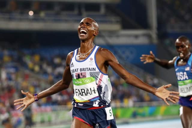 Mo Farah spreads his arms in delight after holding off American Paul Kipkemoi Chelimo to win the final of the  5,000 metres. It is likely to be the last track medal Farah wins at the Olympics as he switches to road racing before the Tokyo Games. Picture: Getty