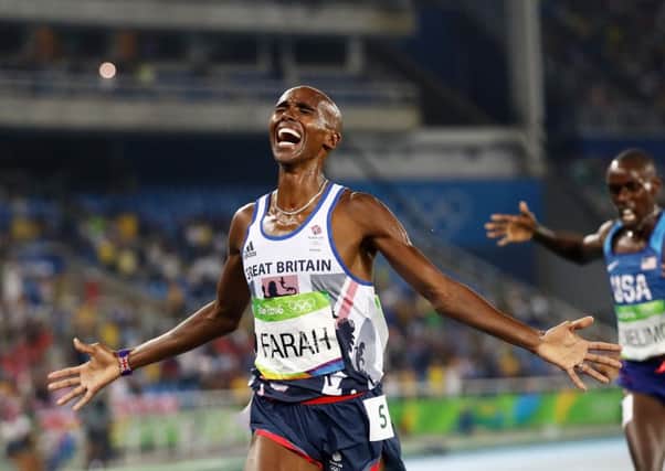 Mo Farah spreads his arms in delight after holding off American Paul Kipkemoi Chelimo to win the final of the 5,000 metres. It is likely to be the last track medal Farah wins at the Olympics as he switches to road racing before the Tokyo Games. Picture: Getty