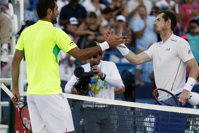 Marin Cilic shakes hands with Andy Murray after winning their match during the finals of the Western & Southern Open tennis tournament. Picture: AP