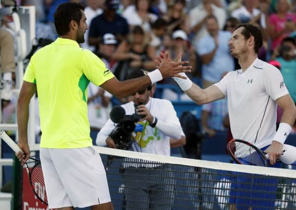 Marin Cilic shakes hands with Andy Murray after winning their match during the finals of the Western & Southern Open tennis tournament. Picture: AP