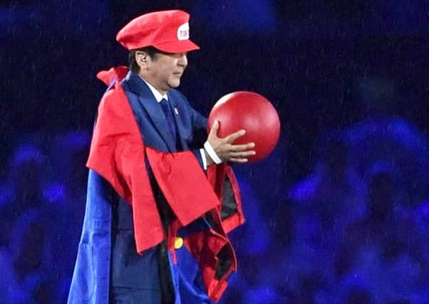 Japanese Prime Minister Shinzo Abe appears as Super Mario at Olympics closing ceremony in Rio. Picture: Yu Nakajima/Kyodo News/AP