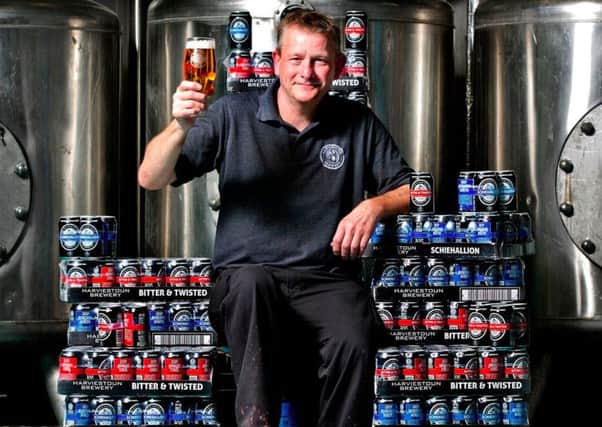 Harviestoun head brewer Stuart Cail raises a glass to the new cans. Picture: Contributed