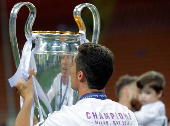 Real Madrid's Cristiano Ronaldo celebrates his side's Champions League triumph in May. The Spanish giants could earn a bigger share of prize money under the proposed Uefa deal. Picture: AP