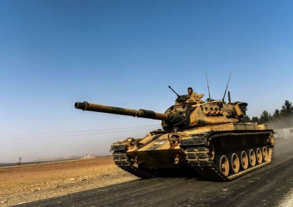 Turkish armour heads for Syria in an operation that puts Turkey on course for a confrontation with US-backed Kurdish fighters. Picture: AFP/Getty Images