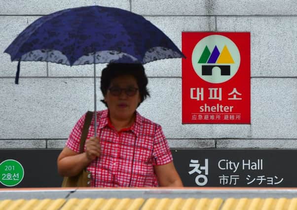 A woman attends a civil defence drill in Seoul, South Korea, in preparation for possible attacks by its neighbour in the north. Picture: AFP/Getty Images