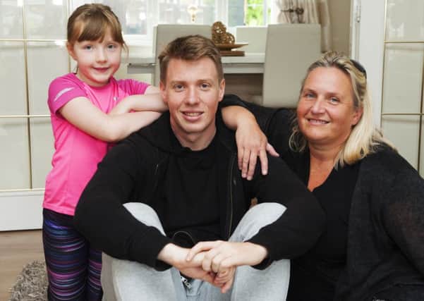 Sister Ellie, 7, Jordan and mum Angela. Picture: Cancer Research UK
