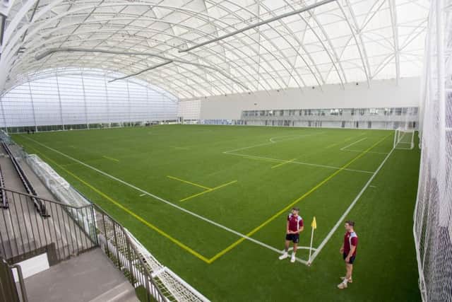 Hearts players Callum Paterson and John Souttar view the new Oriam indoor sports pitch sports. Picture: Ian Rutherford