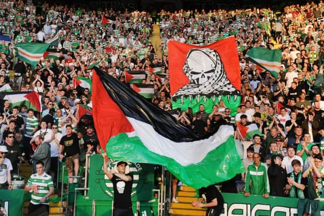 Fans protest with Palestinian flags at Parkhead as Celtic faced H. Beer-Sheva FC. Picture: John Devlin