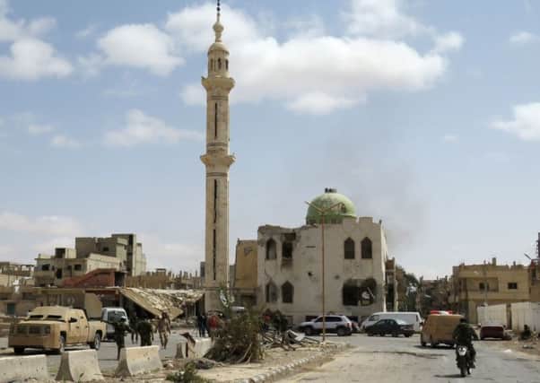 Heavily damaged buildings in a residential neighbourhood of the modern town of Palmyra after Syrian troops recaptured the city. Picture: AFP/Getty Images
