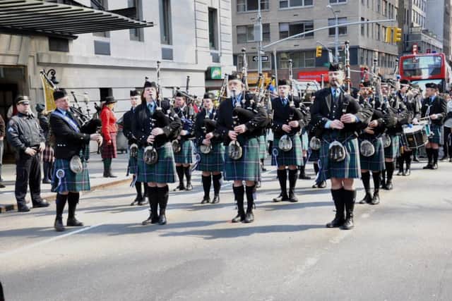 Lanark and District Pipe Band lead New York's Tartan Day Parade.