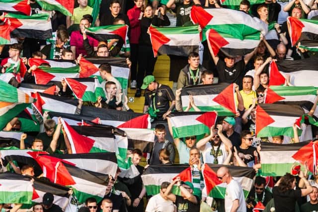 Celtic fans provoked Uefa's ire by displaying Palestinian flags at their match against Hapoel Be'er Sheva. Picture: John Devlin