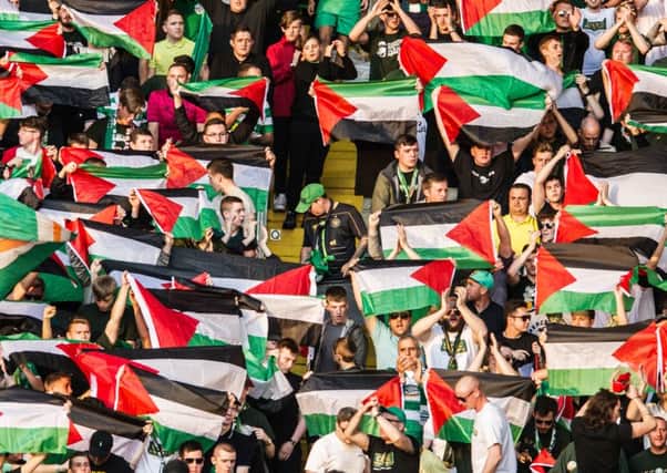 Celtic fans provoked Uefa's ire by displaying Palestinian flags at their match against Hapoel Be'er Sheva. Picture: John Devlin