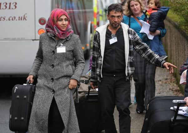 Syrian refugee families arrive at their new homes on the Isle of Bute LAST YEAR. (Photo by Christopher Furlong/Getty Images)
