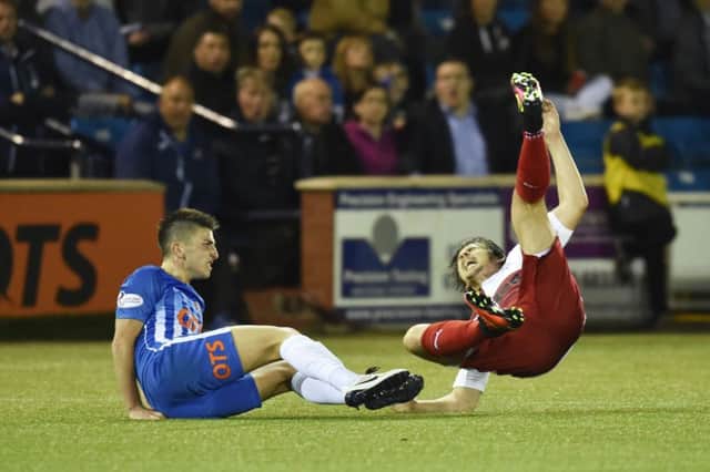Kilmarnock's Greg Taylor was sent off for this tackle on Joey Barton. Picture: Rob Casey/SNS