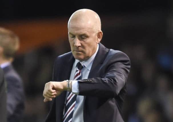 Rangers manager Mark Warburton looks at his watch at Rugby Park. Picture: Ian Rutherford/PA Wire