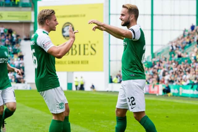 Andrew Shinnie celebrates scoring Hibs' first goal with Jason Cummings. Picture: Ross Parker/SNS