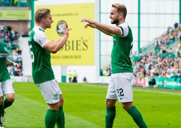 Andrew Shinnie celebrates scoring Hibs' first goal with Jason Cummings. Picture: Ross Parker/SNS