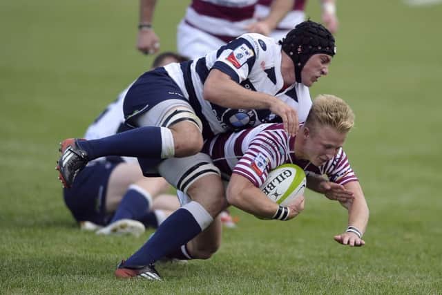 Weiss Cullen of Watsonians sees his attempted break-out halted by Jack McClean.  Picture: Neil Hanna