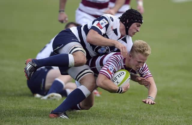 Weiss Cullen of Watsonians sees his attempted break-out halted by Jack McClean.  Picture: Neil Hanna
