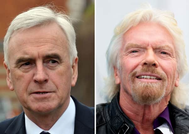 Shadow Chancellor John McDonnell (left) has called for Sir Richard Branson to be stripped of his knighthood. Picture: PA