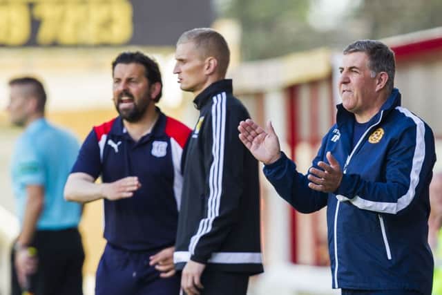 Mark McGhee, right, watches his side play to a 0-0 draw with Dundee. Picture: SNS