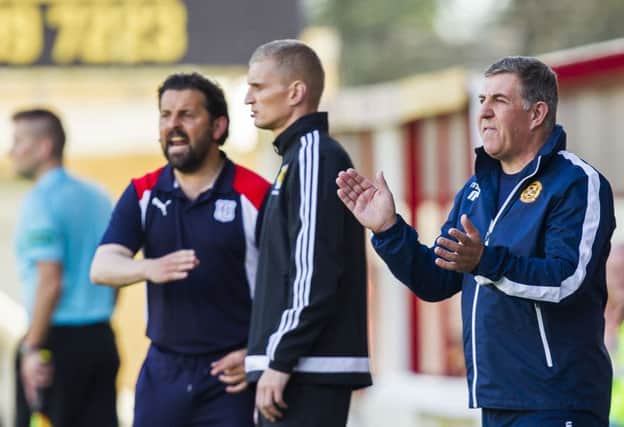 Mark McGhee, right, watches his side play to a 0-0 draw with Dundee. Picture: SNS