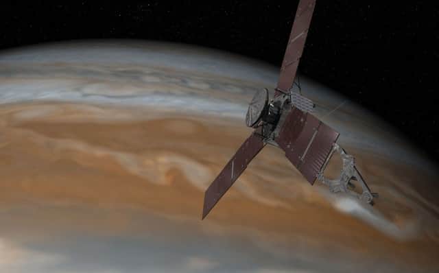 An artists impression issued by Nasa of the Juno spacecraft making its approach to Jupiter. Picture: NASA