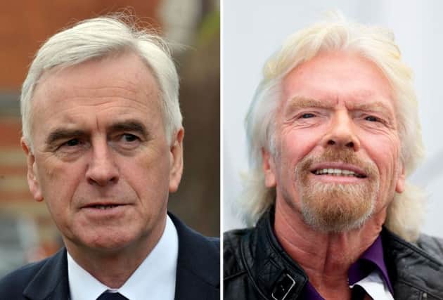 John McDonnell (left) says Sir Richard Branson should be stripped of his knighthood. Picture: PA