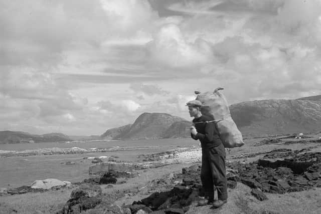 Carrying peats, Fladday, Harris, 1937, by Robert Moyes Adam. Picture: Alan S. Morrison, ASM Media & PR