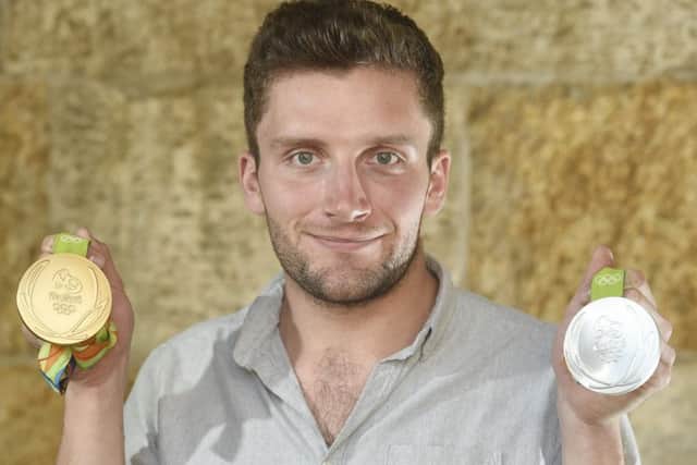 Callum Skinner with the gold and silver medals he won in Rio. Picture: Greg Macvean