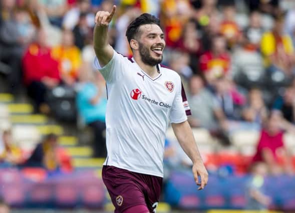 Tony Watt celebrates having scored the winning goal for Hearts in their match at Partick Thistle. Picture: SNS