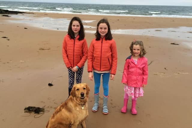 Eilidh, Iona and Grace with Tara the dog. Picture: contributed.