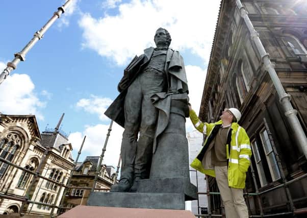 The new statue of William Henry Playfair being installed on Chambers Street. Picture:
 Neil Hanna