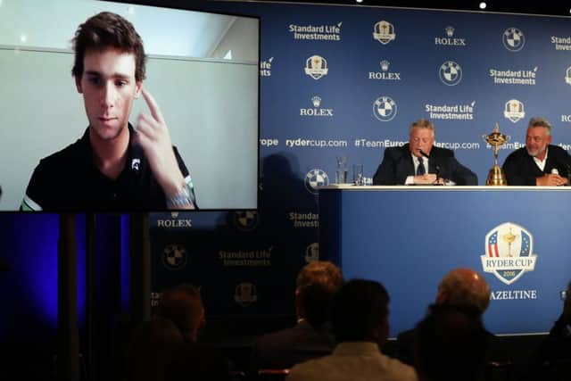Darren Clarke, right, and European Tour communications director Scott Crockett chat with Clarkes third wildcard pick, Thomas Pieters, via video link during a press conference at Wentworth Golf Club. Picture: Andrew Matthews/PA Wire