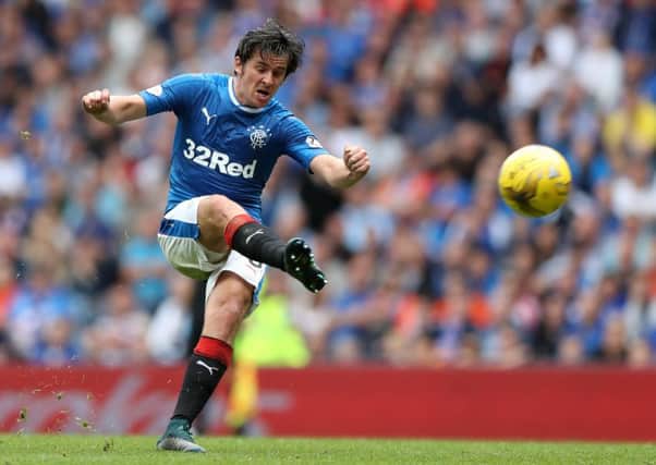 Joey Barton has wound up Scottish football rivals with provocative tweets  but his manager is not worried. Photographs: Getty