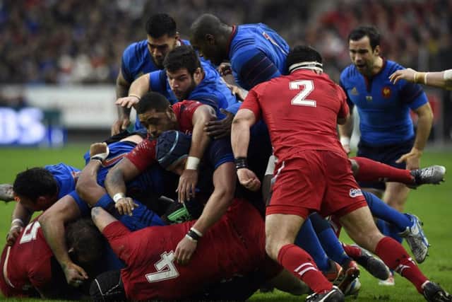 France's and Wales' players vie for the ball in a ruck during the Six Nations international rugby union match between France and Wales on February 28, 2015 at the Stade de France in Saint-Denis, north of Paris.   AFP PHOTO / FRANCK FIFE        (Photo credit should read FRANCK FIFE/AFP/Getty Images)