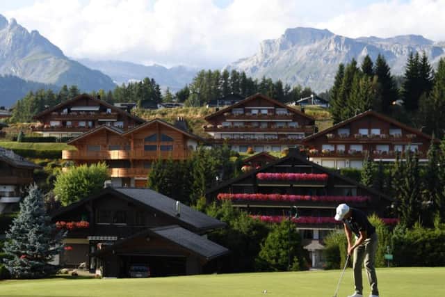 Richard Green holes at birdie at the 14th hole at Crans-sur-Sierre yesterday. Picture: Getty.