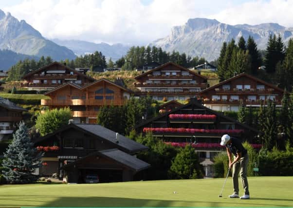Richard Green holes at birdie at the 14th hole at Crans-sur-Sierre yesterday. Picture: Getty.