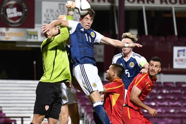 Scotland's Ryan Christie battles with Macedonia goalkeeper Igor Aleksovski in the Tynecastle defeat. Photograph: SNS