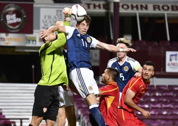 Scotland's Ryan Christie battles with Macedonia goalkeeper Igor Aleksovski in the Tynecastle defeat. Photograph: SNS