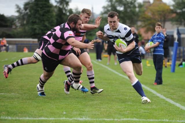 Heriots full-back Gavin Parker goes over for a try on the stroke of half-time.  Photograph: John Devlin
