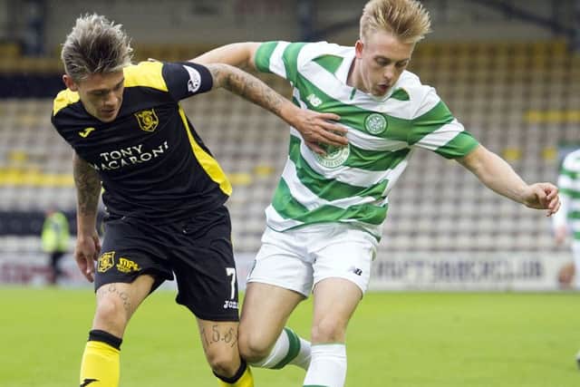 Livingston's Josh Mullin, left, battles against Celtic colts' Calvin Miller. Picture: SNS