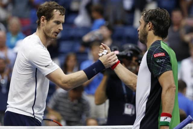 Andy Murray shakes hands with Paolo Lorenzi after his victory over the Italian. Picture: Jason DeCrow/AP