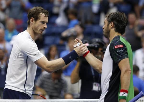 Andy Murray shakes hands with Paolo Lorenzi after his victory over the Italian. Picture: Jason DeCrow/AP