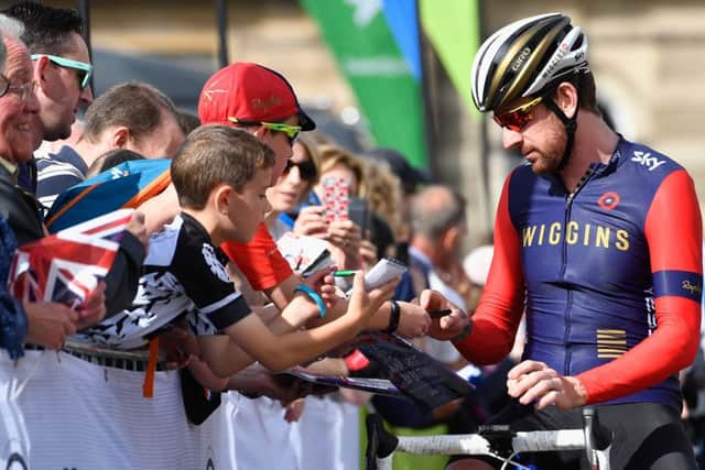 Sir Bradley Wiggins signs autographs prior to stage one of the Tour of Britain in Glasgow. Wiggins finished a distant 111th. Picture: Getty