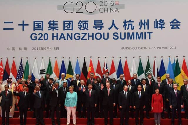Theresa May takes her place among the G20 leaders at a group photocall. Picture: Getty