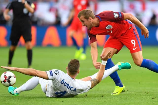 England's Harry Kane (right) and Slovakia's defender Jan Durica vie for the ball during the World Cup 2018 qualification match in Trvana. Picture: Getty