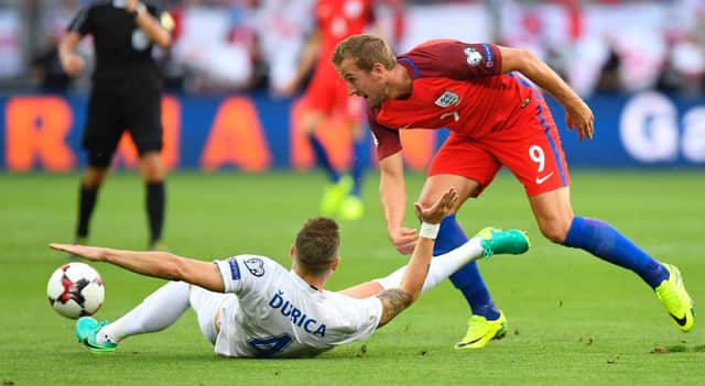 England's Harry Kane (right) and Slovakia's defender Jan Durica vie for the ball during the World Cup 2018 qualification match in Trvana. Picture: Getty
