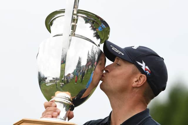 Alex Noren kisses the silverware following his play-off success against Australias Scott Hend. Picture: Getty